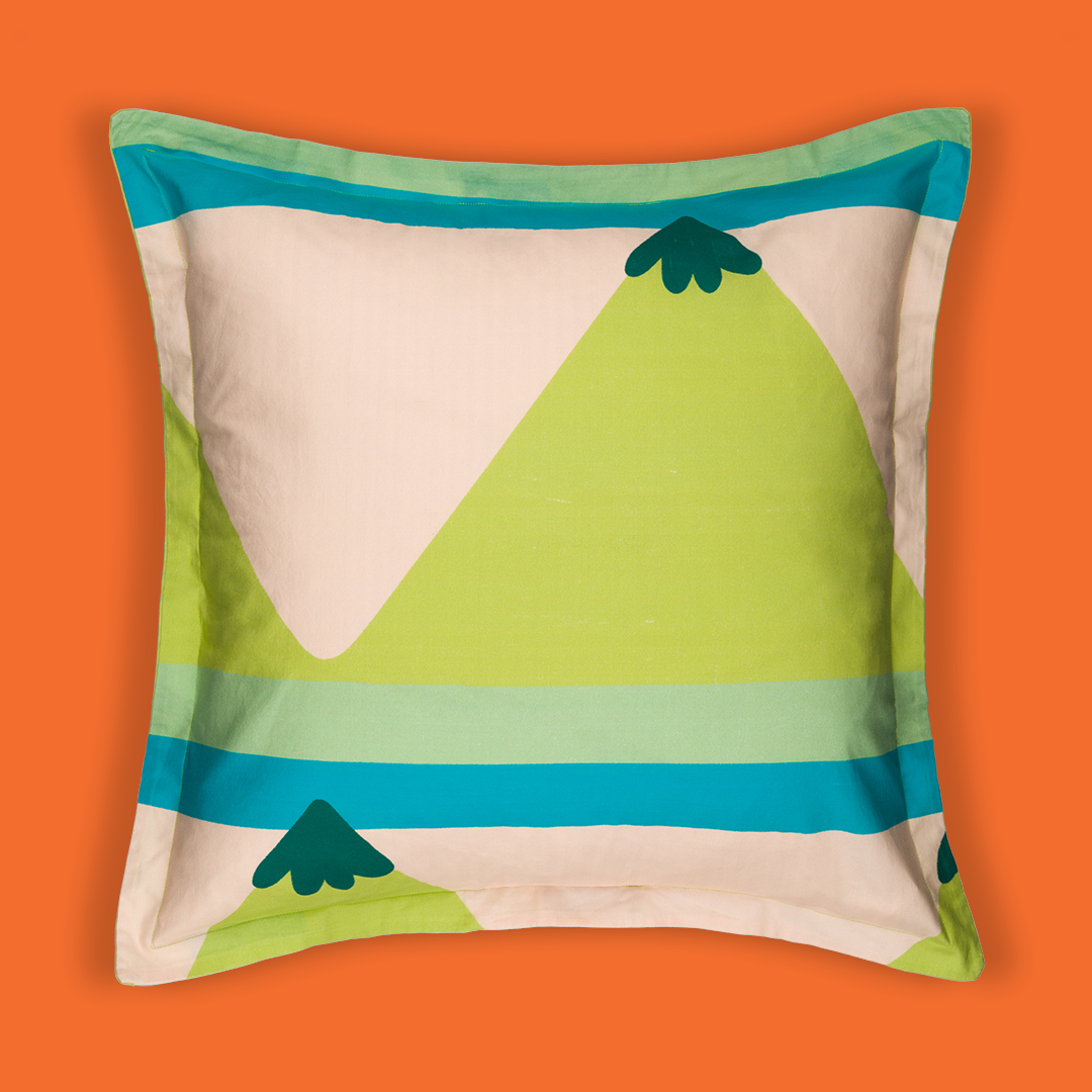 Front of the pillowcase with a mountain on top and stripes in between mountain shapes.