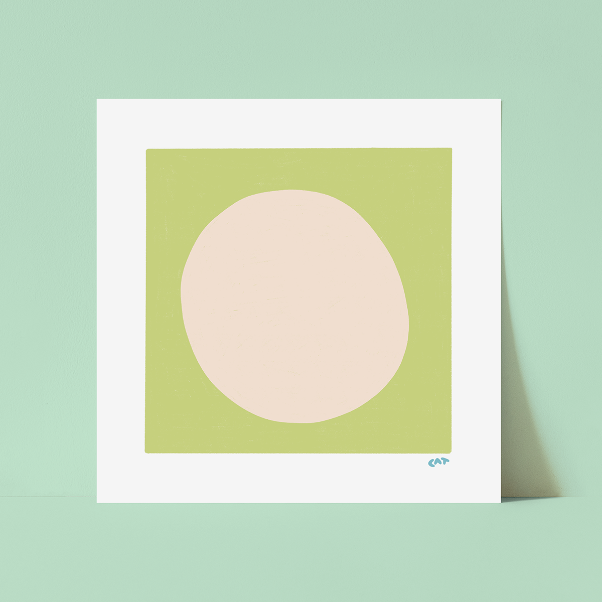 White unframed print of a beige dot on top of a green square.