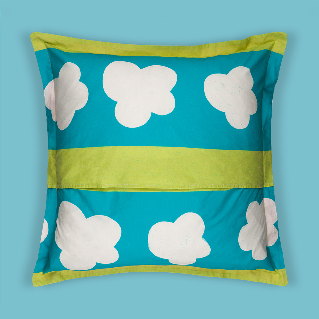 Back print of the pillow that has alternating green and blue stripes. The blue stripes are thicker and have clouds floating across the stripes.