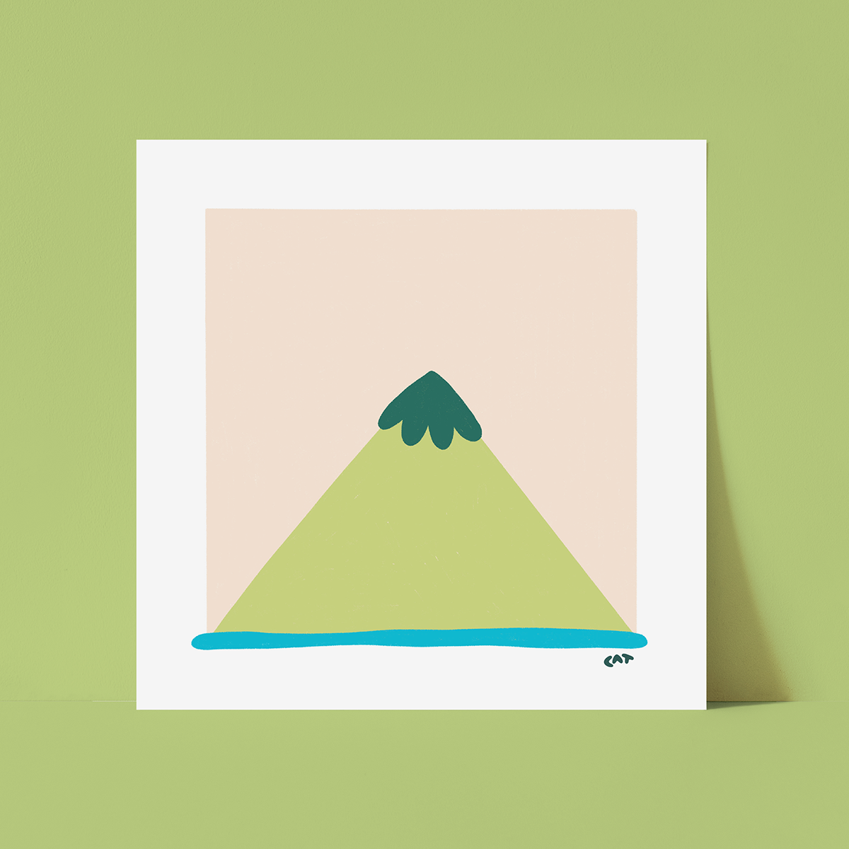 White framed print of a beige square with a green triangle that looks like a mountain, sitting on top of a blue line.