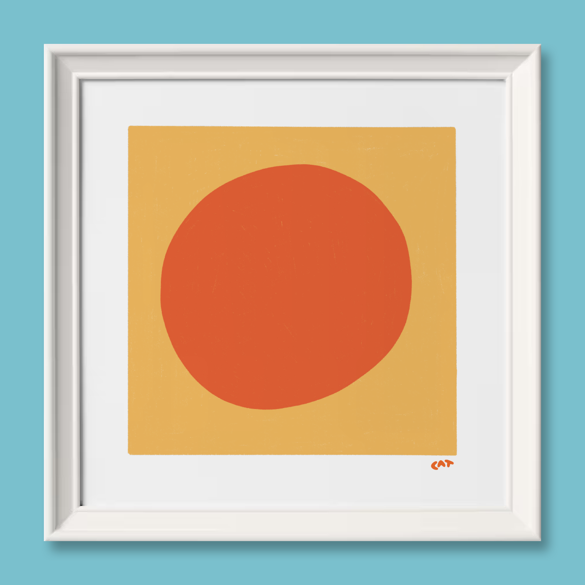 White framed print of a yellow square with an orange dot in the middle of the square.